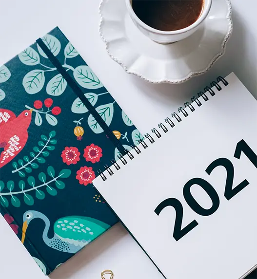 2021 planning book with a cup of coffee